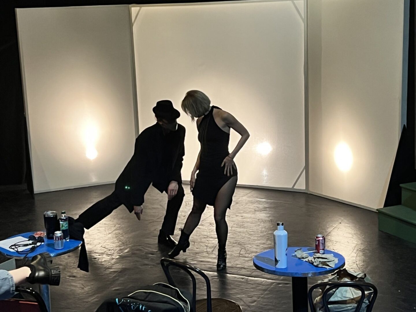 A man and a woman dancing in a studio